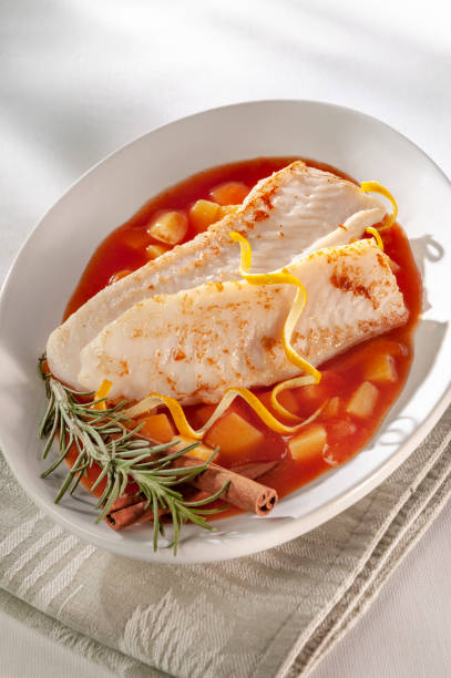 istock Fish fillet with rosemary on a vegetable soup. 1126797122