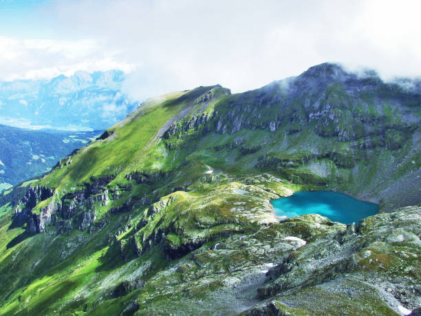 istock Alpine Lake Wildsee under the Pizol peak in the mountain range Glarus Alps 1126797483
