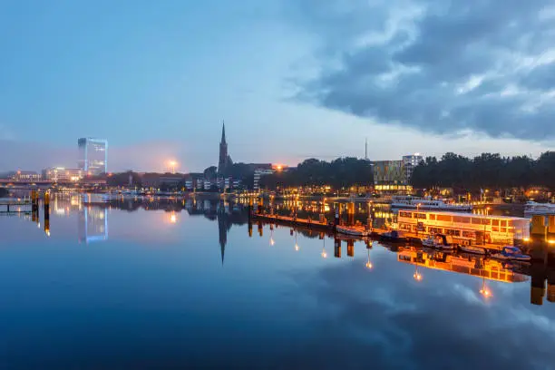 Reflection of Bremen Landmarks in river Weser, Bremen Germany.