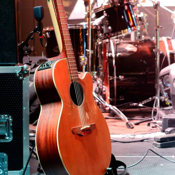 istock Guitar and other musical equipment on stage before concert 1126799662