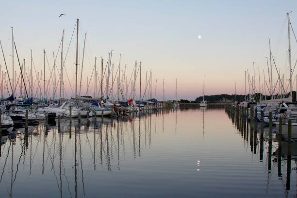 istock The Moon Rising Over A Danish Boat Haven 1126799773