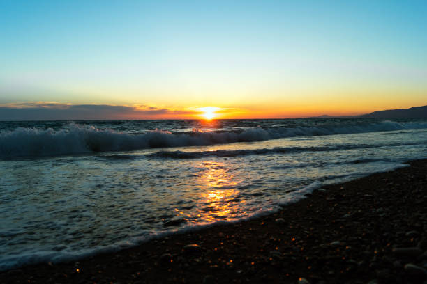 istock Seashore in the evening. Sunset with reflection in the water. Beautiful seascape. 1126800313