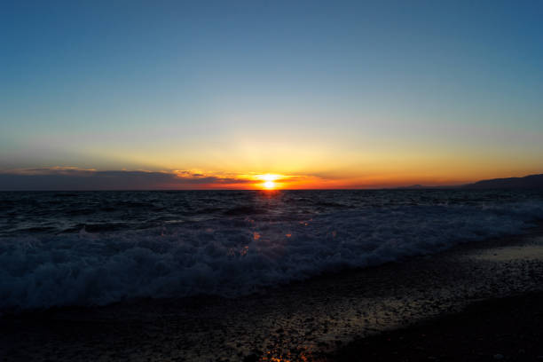 istock Evening seascape. Sunset with reflection in the water. Coastline with sand. 1126800314
