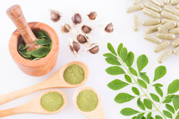 istock Moringa leaves, seeds, powder and capsules - Moringa oleifera 1126800623