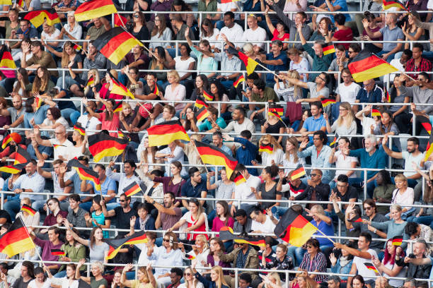 istock Germany supporters waving their flags on a stadium 1126800677