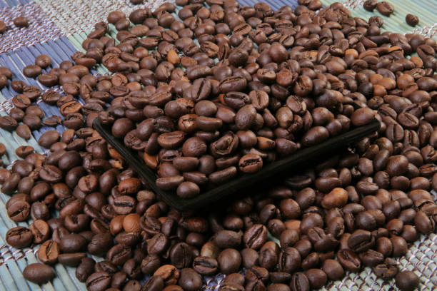 istock A scattering of coffee beans on a plate. 1126805318