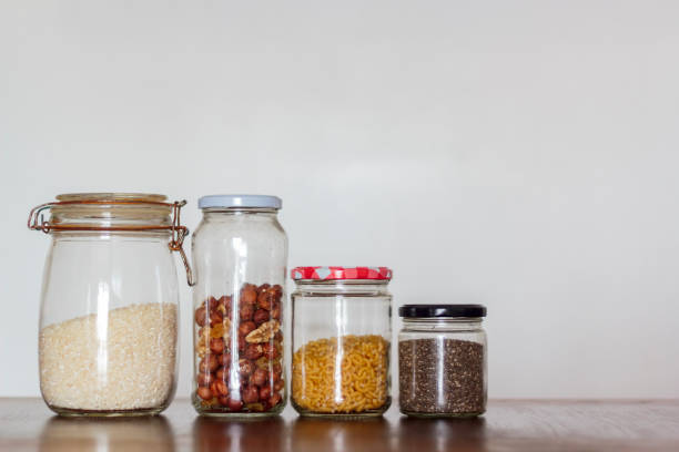 istock Food in glass jars on wooden table with copy space. Zero Waste, plastic free concept 1126806236