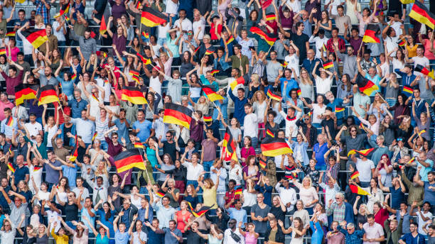 istock Germany supporters waving their flags on a stadium 1126806383