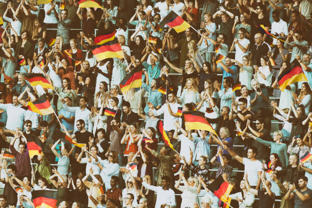 istock Germany supporters waving their flags on a stadium 1126806386