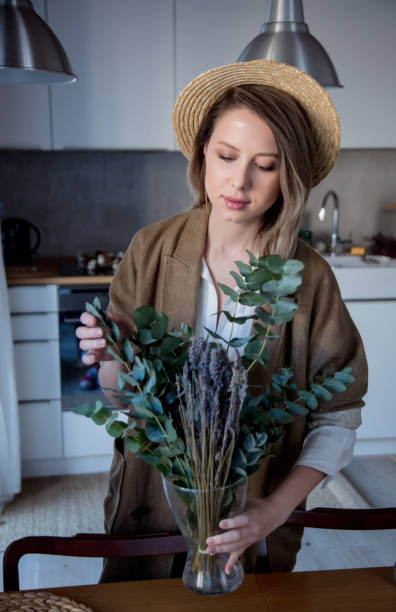 istock girl with eucalyptus and cotton-plant decorating 1126806434