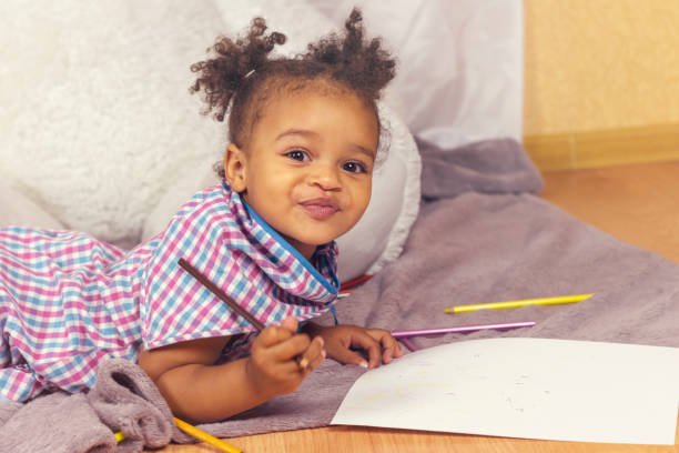 istock Beautiful child enjoying painting 1126806475