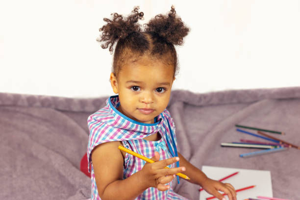 istock Beautiful child enjoying painting 1126807774