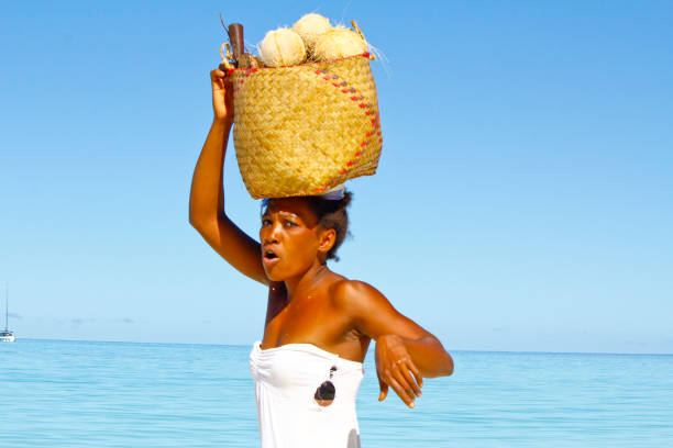 istock Malagasy woman carrying cargo on head 1126808355