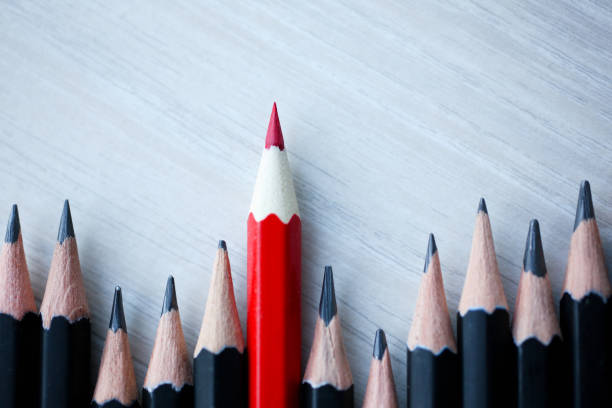 istock Red pencil standing out from crowd of 1126808986