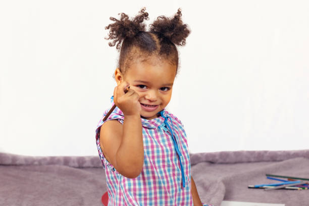 istock African american child with curly hair 1126809331