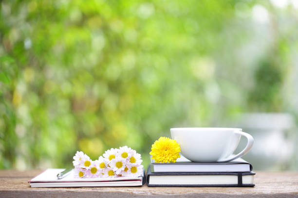 istock marigold flower and white coffee cup 1126809520