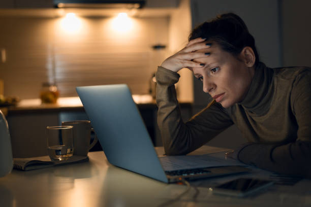 istock Stressed woman working on her monthly finances at home. 1126811094