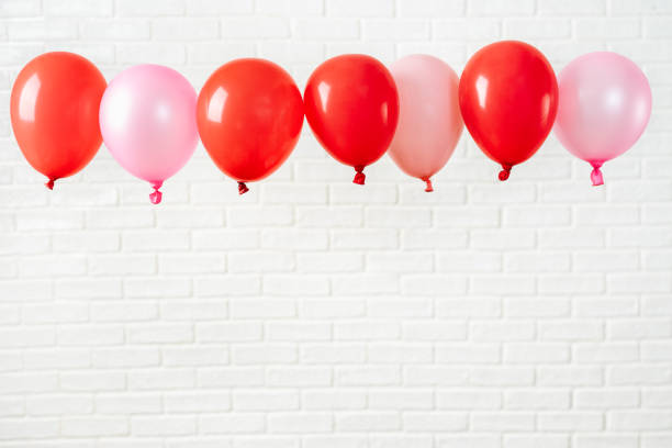 istock Holiday composition with red ballons on white 1126816491