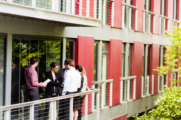 istock Business people discussing on balcony 1126818543
