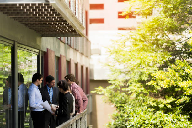 istock Business colleagues discussing strategy on balcony 1126818552