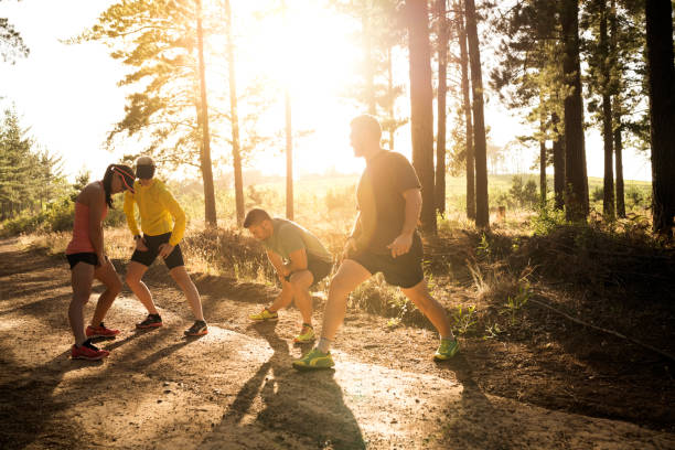 istock Determined friends warming up on dirt road 1126819342