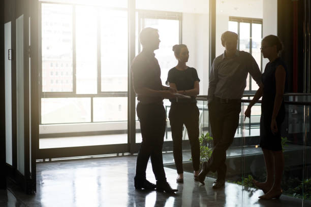 istock Business people discussing at office corridor 1126820267