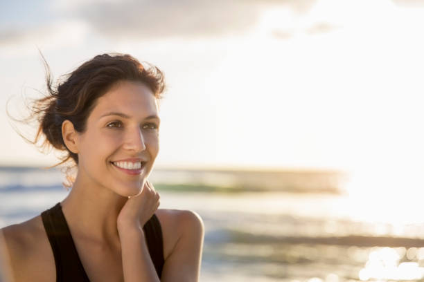istock Smiling female athlete looking away at beach 1126820951