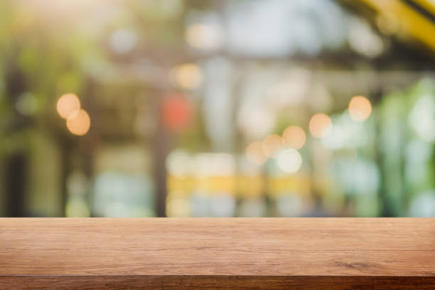 istock Empty wood table top and blurred restaurant interior background - can used for display or montage your products. 1126822738