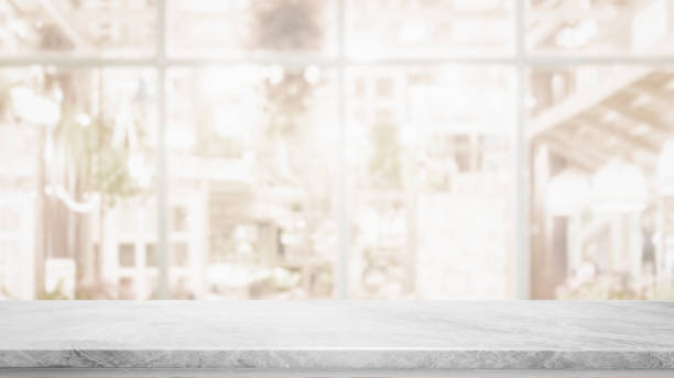 istock Empty white marble stone table top on blurred with bokeh cafe and restaurent interior background - can be used for display or montage your products 1126822757