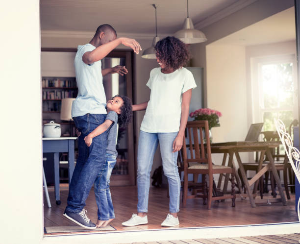 istock Son picking up father at house entrance 1126822797