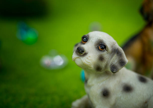 Cute little Dog : small figurines of animals, stone figure statue, object macro , toy animals.