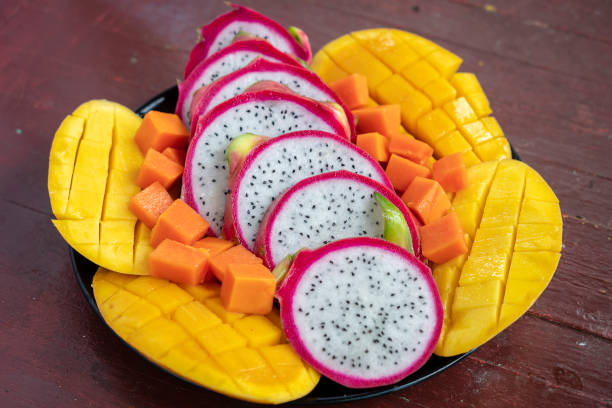 istock Tropical fruits assortment on a plate, close up 1126824017