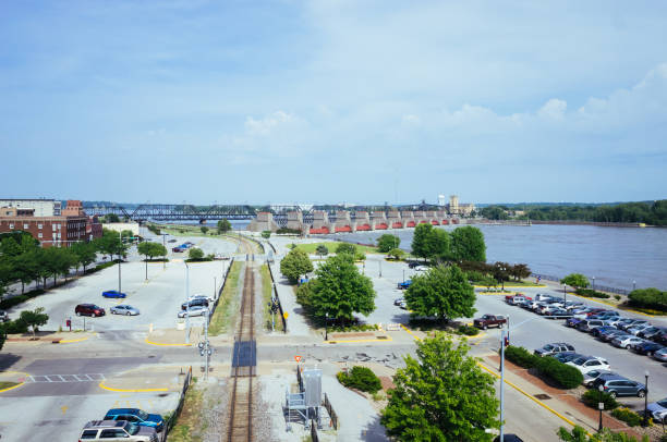 Parking lots, tran track, and Mississippi River, in Davenport, Iowa, USA View of parking lots, tran track, and Mississippi River, in Davenport, Iowa, USA davenport iowa stock pictures, royalty-free photos & images