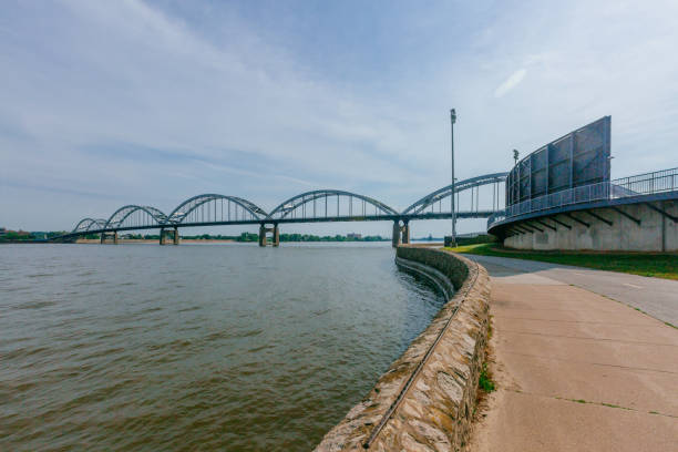 Centennial Bridge over Mississippi River in Davenport, Iowa, USA View of Centennial Bridge over Mississippi River in Davenport, Iowa, USA davenport iowa stock pictures, royalty-free photos & images