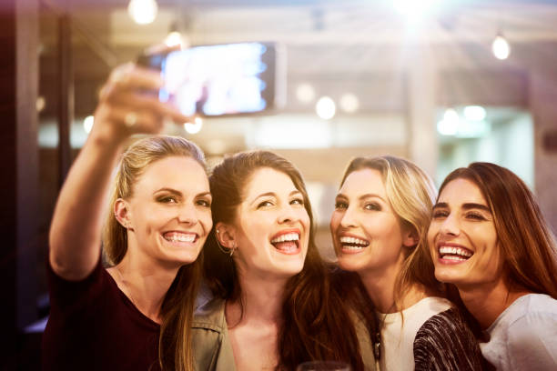 istock Young females taking selfie through mobile phone 1126825849