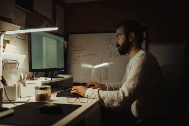 istock Young man brainstorming and working late at the home office 1126827748