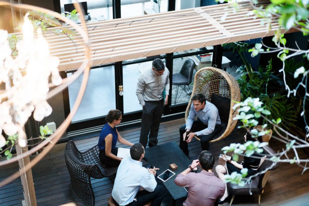istock Business people discussing at office lobby 1126829167