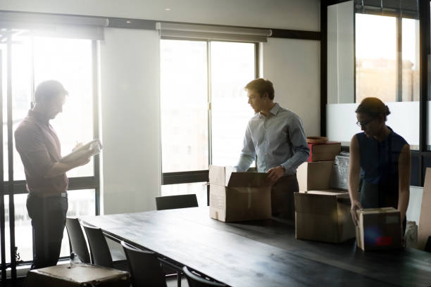 istock Businessman explaining coworkers in packing boxes 1126830012