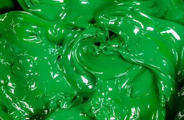 Photo of close up dark green color of oil paint