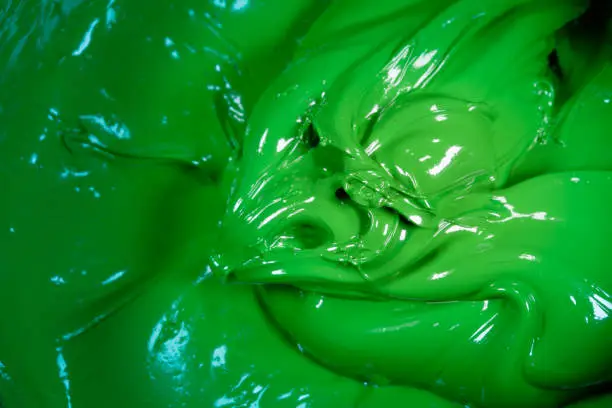 Photo of close up green color of oil paint