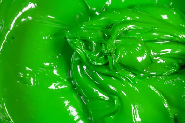 Photo of close up green color of oil paint