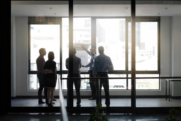 istock Business people discussing in board room meeting 1126831290