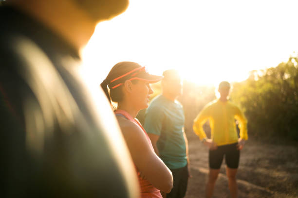 istock Woman with friends resting after jogging 1126833144