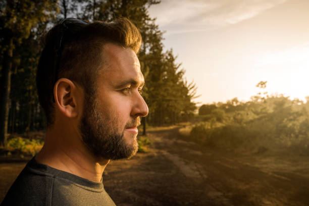 istock Fit young man looking away in forest 1126833201