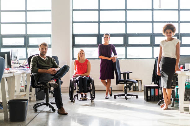 istock Confident business people at creative office 1126836762