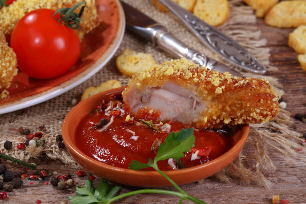 istock Still Life with chicken nuggets, greens on wooden table 1126839689