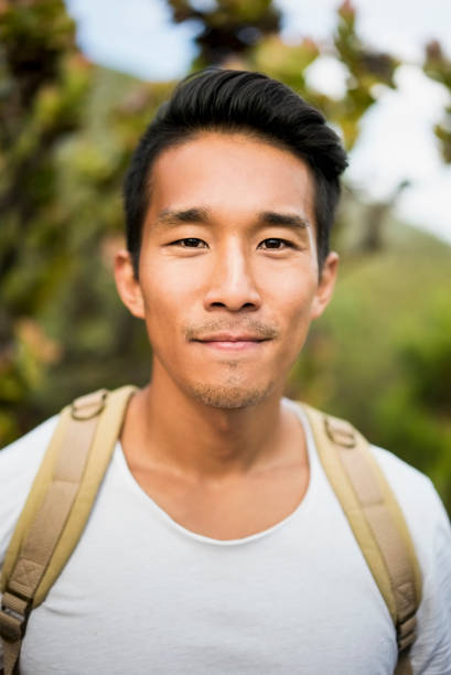 istock Close-up portrait of confident male backpacker 1126839923
