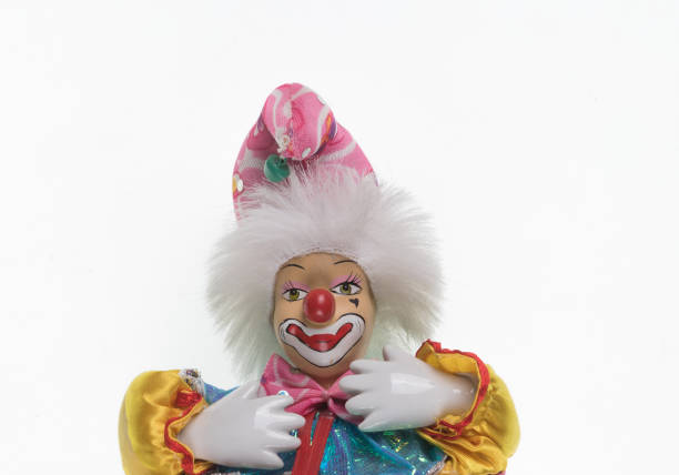 clown toy on white isolated background clown toy on white isolated background кукла stock pictures, royalty-free photos & images