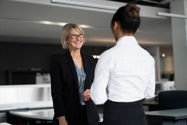 istock Female manager talking to executive in office 1126842381