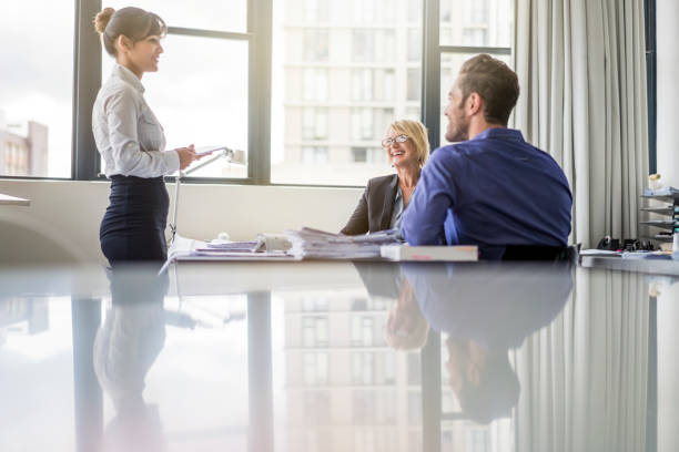istock Business people discussing at desk in office 1126842481